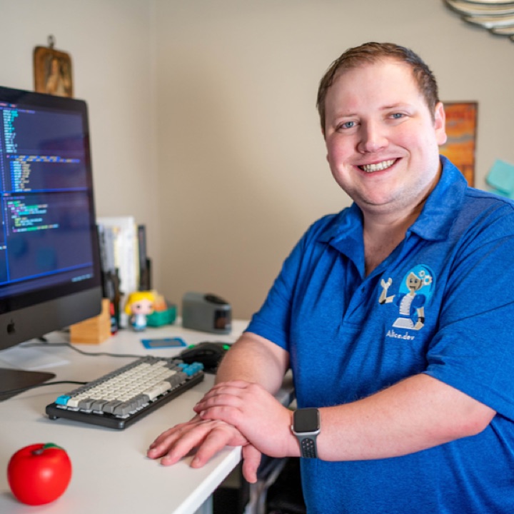 Michael Dominick at his desk